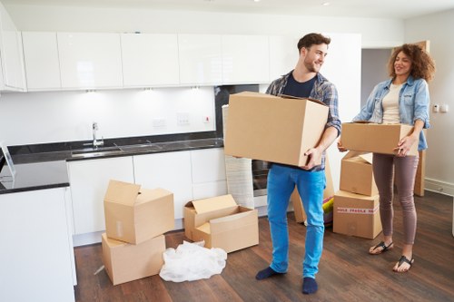 Expert movers handling office equipment during a move