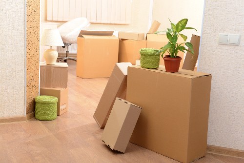 Experienced movers handling items in a Putney moving truck
